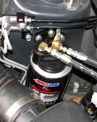 Amsoil's BMK-21 attached to Subaru's engine compartment.